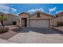 Single story home with a two car garage and desert landscaping at 6432 S 23Rd Ave, Phoenix, AZ 85041