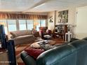 Comfortable living room with large windows providing natural light and a welcoming atmosphere at 7750 E Broadway Rd # 123, Mesa, AZ 85208