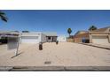 Charming single-story home featuring a two-car garage and xeriscaping at 812 E Piute Ave, Phoenix, AZ 85024