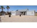 Inviting single-story home with a two-car garage and desert landscaping at 812 E Piute Ave, Phoenix, AZ 85024