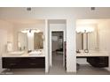A spacious primary bath boasts double vanities, large mirrors, and walk-in closet access at 8230 E Via Del Sol Dr, Scottsdale, AZ 85255