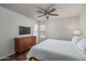 Comfortable bedroom with a neutral color palette, dresser, and ceiling fan at 8787 E Mountain View Rd # 2008, Scottsdale, AZ 85258
