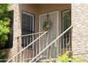 Welcoming entrance featuring a security door and cheerful wreath at 8787 E Mountain View Rd # 2008, Scottsdale, AZ 85258