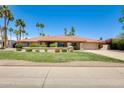 Charming home with a well-maintained lawn and vibrant landscaping, showcasing curb appeal at 8907 N 85Th Way, Scottsdale, AZ 85258