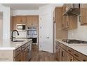 Bright kitchen boasting stainless steel appliances, light countertops, and wood cabinets at 10022 S 37Th Ave, Laveen, AZ 85339