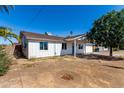 Well-maintained home with a tidy front yard and a covered entrance, offering great potential for new owners at 13039 N 19Th Ave, Phoenix, AZ 85029