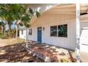 Inviting home with covered front porch, perfect for relaxing, with neutral colors and an attractive front door at 13039 N 19Th Ave, Phoenix, AZ 85029
