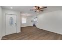 Inviting living room with wood-look floors that flows seamlessly into the adjacent updated kitchen at 1529 E Edgemont Ave, Phoenix, AZ 85006