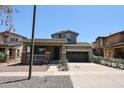 Charming two-story home featuring a welcoming front porch and a two-car garage at 15365 W Valentine St, Surprise, AZ 85379