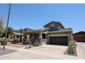 Charming two-story home featuring a welcoming front porch and a two-car garage at 15365 W Valentine St, Surprise, AZ 85379