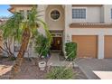 Inviting entrance with lush landscaping, desert gravel, and a solid wood front door at 15829 S 13Th Pl, Phoenix, AZ 85048