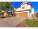 Charming two-story home featuring desert landscaping, a two-car garage, and a covered entryway at 15829 S 13Th Pl, Phoenix, AZ 85048