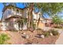 Beautiful desert-landscaped home with a two-car garage and mature trees for shade at 15829 S 13Th Pl, Phoenix, AZ 85048