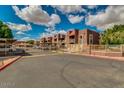 Well maintained Autumn Park Condominiums feature ample parking, gated entry, and mature trees at 16602 N 25Th St # 223, Phoenix, AZ 85032