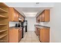 Well-lit kitchen with ample cabinet space, modern appliances, and a functional layout for easy meal preparation at 16602 N 25Th St # 223, Phoenix, AZ 85032