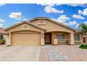 Charming single-story home featuring a two-car garage and neutral-toned exterior with well-maintained landscaping at 2300 E Austin Dr, Gilbert, AZ 85296