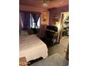 Bedroom with an office setup, providing a functional and comfortable living space at 2802 W Lawrence Rd, Phoenix, AZ 85017