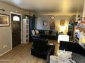 Comfortable living room with hardwood floors and ample natural light at 2802 W Lawrence Rd, Phoenix, AZ 85017