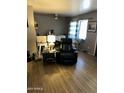 Cozy living room featuring hardwood floors and a comfortable seating arrangement at 2802 W Lawrence Rd, Phoenix, AZ 85017