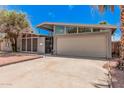 Inviting home showcases a well-maintained exterior with a spacious driveway at 3013 W Port Au Prince Ln, Phoenix, AZ 85053