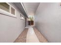 Side yard walkway with gravel and a privacy gate at 3013 W Port Au Prince Ln, Phoenix, AZ 85053