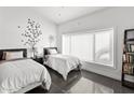 Bright bedroom featuring two beds, stylish decor, and a large window at 3233 N 37Th St # 5, Phoenix, AZ 85018