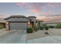 Charming home featuring desert landscaping, a two-car garage, and a desert-toned facade at 343 W Twin Peaks Pkwy, San Tan Valley, AZ 85143