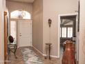 Welcoming entryway with a decorative rug and tiled floors, featuring a view into the bright living space at 4970 S Desert Willow Dr, Gold Canyon, AZ 85118