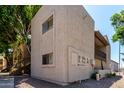 The rear exterior of this multifamily home is surrounded by lush foliage at 520 N Stapley Dr # 253, Mesa, AZ 85203