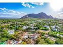 An aerial view of the estate showcases its prime location, complete with serene mountain views at 6701 E San Miguel Ave, Paradise Valley, AZ 85253