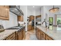 Gourmet kitchen featuring custom cabinets, granite countertops, stainless steel appliances, and tile flooring at 7130 E Saddleback St # 58, Mesa, AZ 85207