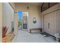 Inviting front entrance with bench seating and decorative wall art at 715 W Townley Ave, Phoenix, AZ 85021