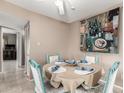 Cozy dining area with seating for four, next to the kitchen and living room at 7436 E Chaparral Rd # 124B, Scottsdale, AZ 85250