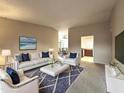 Bright living room featuring modern decor, plush seating, and neutral color palette at 11022 S Iroquois Dr, Phoenix, AZ 85044