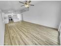 Spacious and bright living area with modern flooring and an open layout at 1211 S Pueblo Ct, Gilbert, AZ 85233