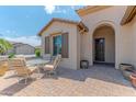 Inviting front patio area with seating, providing an ideal spot for outdoor relaxation at 15353 W Cheery Lynn Rd, Goodyear, AZ 85395
