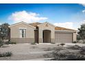 Charming single story home with tan stucco exterior, tiled roof, an arched entry, desert landscaping, and a two car garage at 18522 W Mohave St, Goodyear, AZ 85338