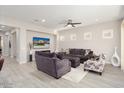 Spacious living room features recessed lighting, neutral decor, and wood-style flooring at 29344 N 132Nd Ln, Peoria, AZ 85383