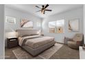 Cozy bedroom featuring a ceiling fan, natural light, and neutral decor at 2962 E Birdsong Ave, San Tan Valley, AZ 85143