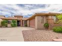 Lovely desert home showcasing neutral stucco and attractive rock front yard at 3613 W Plymouth Dr, Anthem, AZ 85086