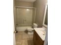 Functional bathroom featuring a tub/shower combo, toilet, and vanity with sink, ready for upgrades at 4119 N 105Th Ln, Phoenix, AZ 85037