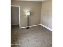 Cozy bedroom with neutral carpeting and paint, providing a blank canvas for your design ideas at 4119 N 105Th Ln, Phoenix, AZ 85037