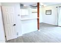 Spacious living area with neutral-toned flooring and convenient kitchen access at 4124 N 81St St, Scottsdale, AZ 85251