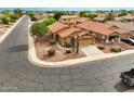 Aerial view of a corner lot home with desert landscaping and a two-car garage at 44010 W Wade Dr, Maricopa, AZ 85138