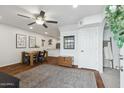 Bright dining room featuring wood floors, modern decor, and a ceiling fan for added comfort at 510 N Alma School Rd # 252, Mesa, AZ 85201