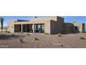 Modern home featuring desert landscaping, covered patio, and expansive glass windows offering beautiful views at 532 E Paint Your Wagon Trl, Phoenix, AZ 85085
