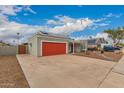 View of home with desert landscaping and RV parking on a sunny day with blue skies and clouds at 6038 W Gelding Dr, Glendale, AZ 85306