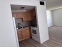 This kitchen features stainless steel appliances and shaker style cabinets at 700 W University Dr # 203, Tempe, AZ 85281
