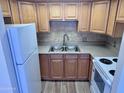 The Kitchen features stainless steel appliances and shaker style cabinets at 700 W University Dr # 203, Tempe, AZ 85281