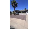 Single story home with manicured rock landscaping, well maintained exterior, and palm tree at 8618 N 45Th Dr, Glendale, AZ 85302
